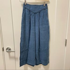 Wilfred denim skirt with pockets and side slits.